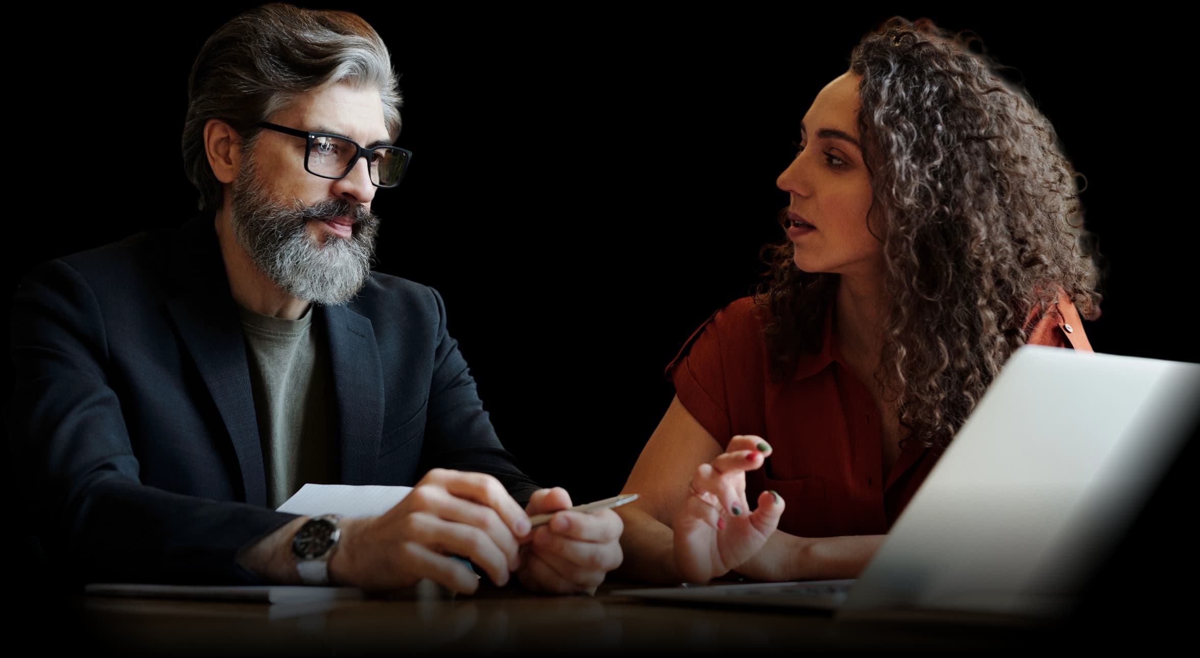 A health plan advisor and an employer reviewing population engagement together.